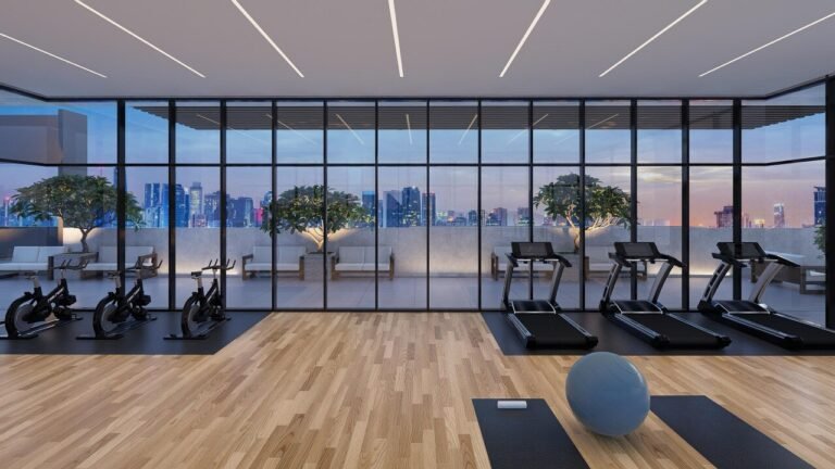 Modern Horizon Gym with cardio equipment and Kuala Lumpur city views at Khaya Residences